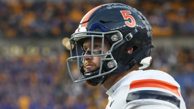 Virginia quarterback Brennan Armstrong (5) looks on from the sidelines against Pittsburgh during the second quarter at Heinz Field.